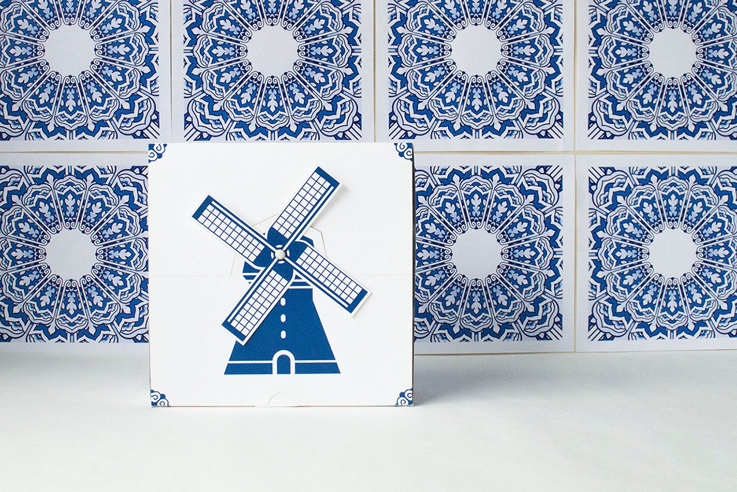 The top of the box folded up features a Dutch windmill with sails that can rotate.