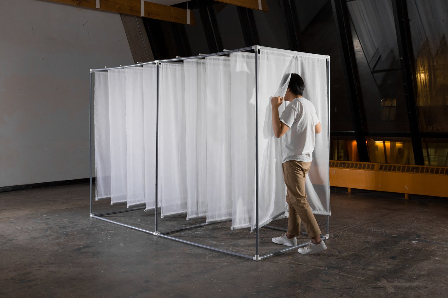 Person moving through installation